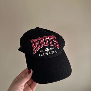 Roots Canada Black Cap with Green Label